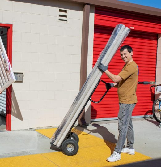 Smoove mover with a hand truck outside storage units